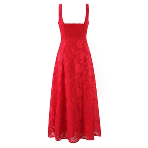 Detailed view of the red dress with floral jacquard texture and elastic smocked back