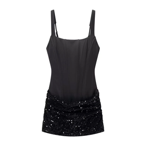 Macro view of corset bodice with fishbone structure and shimmering sequin detailing