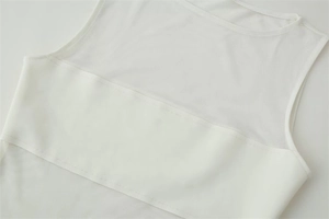 Detailed macro view of white sleeveless bodysuit featuring textured mesh stitching details