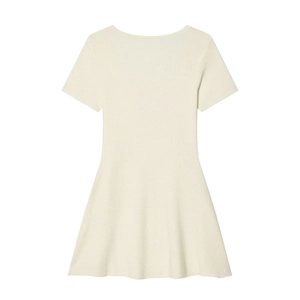 Detailed macro view of the knit fabric texture on a short sleeve cream dress