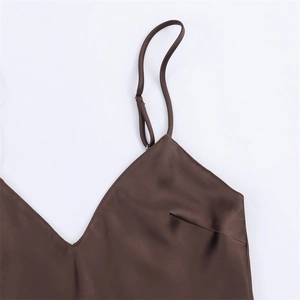 Detail of coffee brown satin camisole dress featuring thin adjustable straps and V-neckline