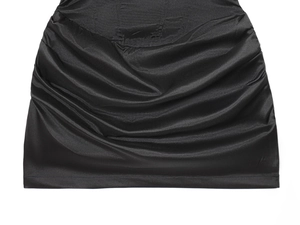 Detailed macro view of black satin fabric with elegant horizontal ruched pleats