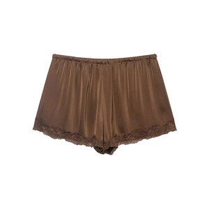 Detail of dark brown satin shorts featuring delicate lace trim and elastic waistband