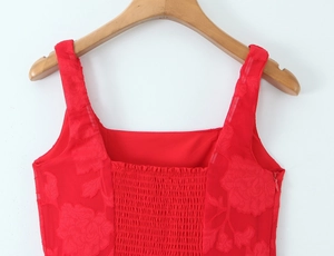 Detail of red floral jacquard dress featuring square neckline and smocked elastic back