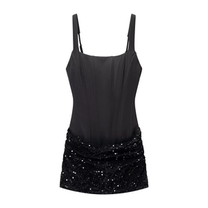 Chic black corset top with adjustable straps and shimmering sequin patchwork hem
