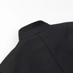 Detail of mandarin collar and rib texture on black Neo-Chinese style jacket