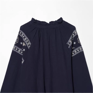 Navy blue boho blouse with white ethnic embroidery and ruffled high neck in crepe fabric
