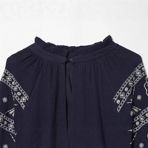 Navy embroidered puff sleeve shirt with ruffle stand collar and geometric patterns