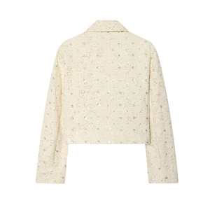 Rear view detail of elegant beige tweed cropped jacket with subtle sequin embellishments