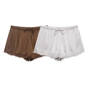 Women's silk satin lounge shorts with lace trim and bow drawstring in brown and white
