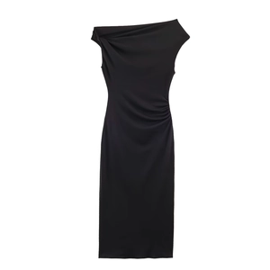 Detail of elegant one-shoulder neckline with ruched black fabric on a midi dress