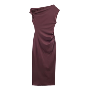 Detail of elegant wine red one-shoulder dress with side ruching and satin-like texture