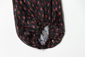 Detail of floral print chiffon blouse showing pleated texture and elastic cuffs