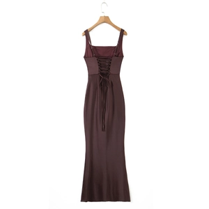 Detail of a chocolate satin dress featuring an elegant lace-up open back design