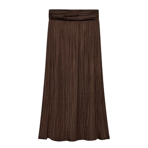 Detailed view of the pleated texture and elastic waistband on coffee brown satin skirt