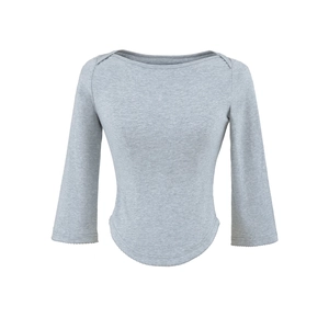 Detail view of light grey slim fit top with boat neck and elegant wavy hem finish