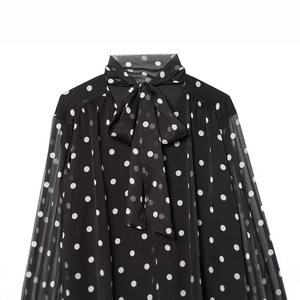 Elegant black polka dot pussy-bow blouse with sheer long sleeves and vintage high neck