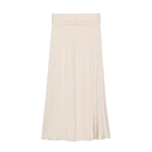 Close-up of elegant champagne satin maxi skirt with high waist pleats and silk texture