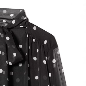 Women's polka dot chiffon shirt with pussy-bow neck and pleated shoulders in black and white
