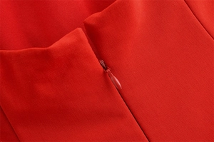 Close-up of invisible zipper closure on a red sleeveless slim fit dress for women