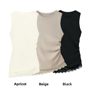 Detail view of lace hem stitching and side ruching on three colors of knit tank tops