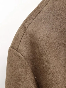 Detail of shoulder stitching on brown faux suede jacket with ribbed texture finish