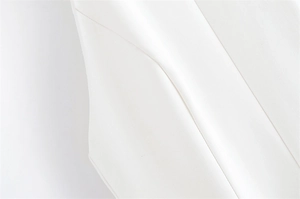 Detailed macro view showing the high-quality white fabric texture and precise stitching detail