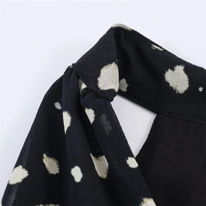 Macro detail of high-quality polka dot chiffon fabric with fine stitching for women's dress
