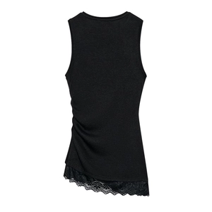 Detailed view of the side ruching and delicate black floral lace hem on the top