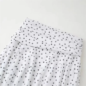 Polka dot mesh skirt with elegant ruched details and a classic white and black print