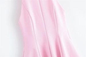 Detail of pink slim-fit dress showing vertical princess seams for a shaping effect