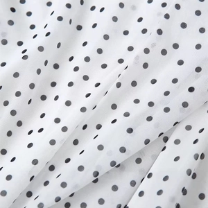 Polka dot white long skirt in lightweight chiffon fabric with elegant pleated texture
