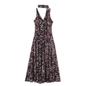 Chic dark brown polka dot sleeveless dress with deep V-neck and elegant draped waist detail