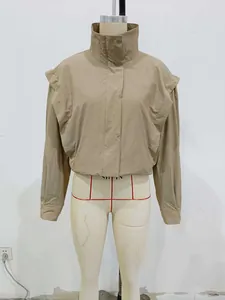 Detail view of khaki jacket with high collar and ruffle shoulder decorative trim