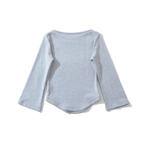 Detail view of grey boat neck top featuring delicate lace trim and curved hemline