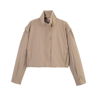 Detail of khaki cropped high-neck jacket featuring layered drop shoulders and hidden zipper