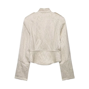 Detail of floral jacquard texture on beige stand collar jacket back view