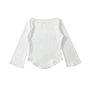 Detail of white boat neck top showing lace trim on the curved hem and flared sleeves