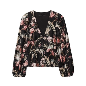 Detailed view of deep V-neck floral chiffon blouse with button front and peplum hem