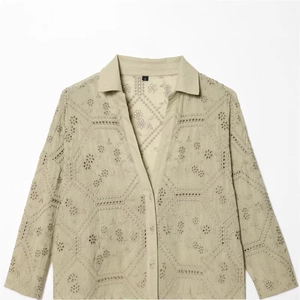 Women's sage green button-down shirt with intricate floral hollow embroidery detail
