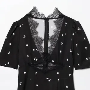Floral V-neck mini dress with lace trim and puff sleeves in black and white pattern
