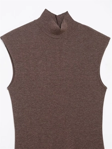 Detailed texture of dark brown sleeveless knit top with mock neck and speckled finish