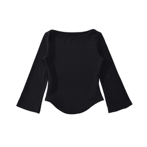 Detail of boat neck slim fit top with elegant ruffled hem and flared sleeve edges