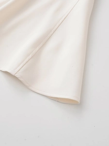 Detailed macro view of the cream-white twill fabric and high-quality hem stitching