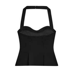 Detail of black halter corset top featuring a heart neckline and button closure