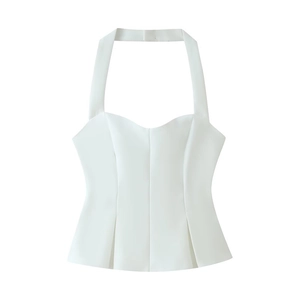 Detail of white halter neck top featuring a sweetheart neckline and pleated hem structure