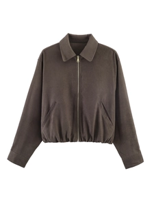 Detailed view of dark brown zip-up jacket featuring polo collar and elasticated hemline