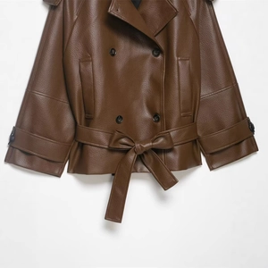 Short faux leather double-breasted jacket with waist belt and pebbled texture