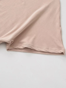 Detail shot of the lotus pink knitted cotton hem showing double needle stitching quality