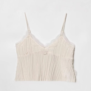 Chic cream white V-neck camisole with delicate lace trim and pleated texture fabric